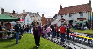 Photograph of tables being set up outside the Tiger, North Newbald, for the 2012 Jubilee celebrations